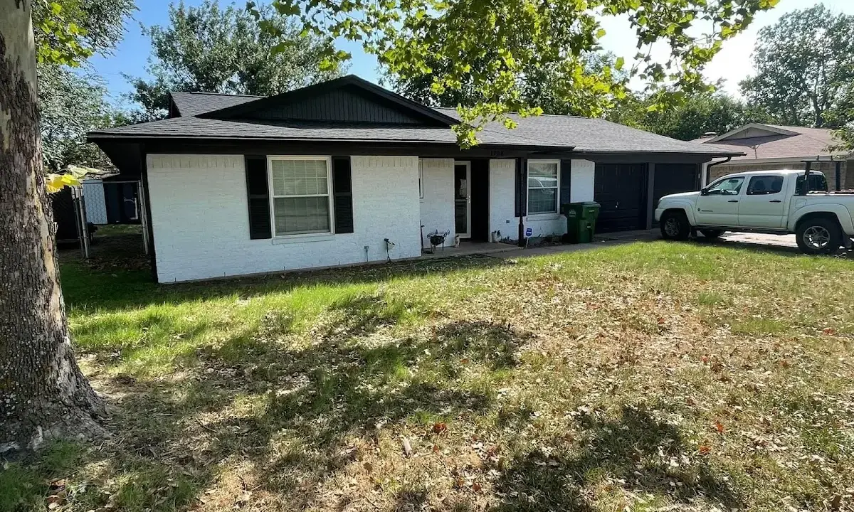 Professional roofing crew working on a residential roof in Winchester